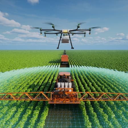 A drone flying over a large green field, assisting a tractor in precision irrigation, representing advanced agricultural technology and water efficiency.